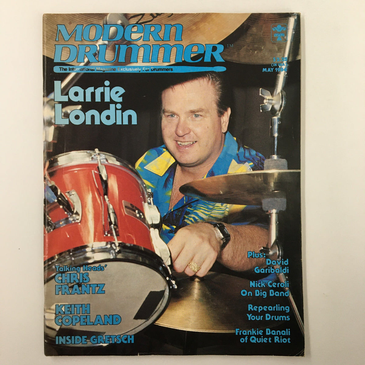 Modern Drummer Magazine May 1984 featuring Larrie Londin on the cover. The magazine showcases notable drummers and includes interviews and articles about drumming culture.