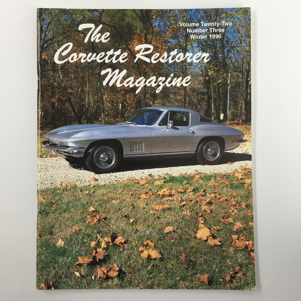 The Corvette Restorer Magazine Winter 1996 cover featuring a classic silver Corvette parked on a gravel driveway with autumn leaves on the ground.
