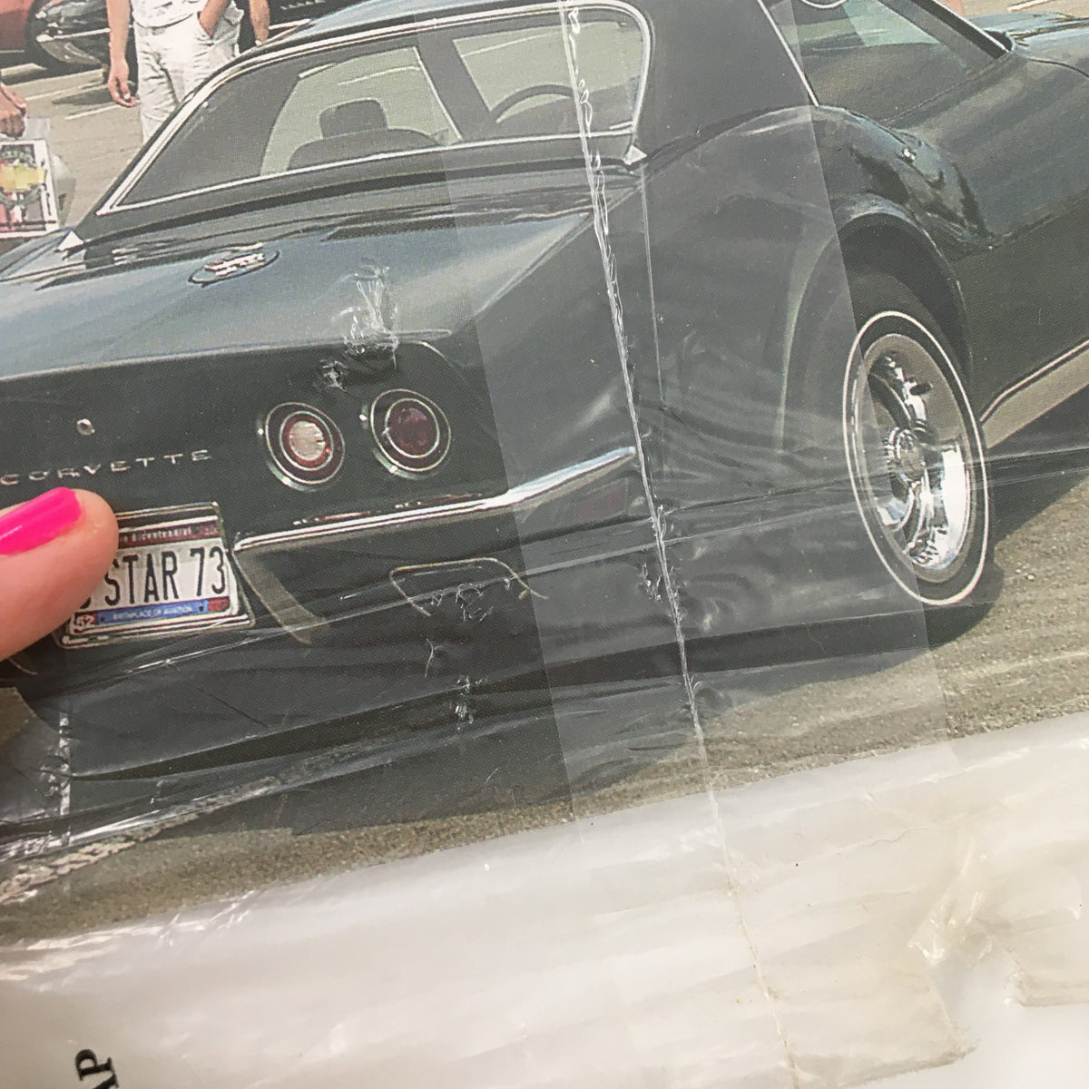 Detailed shot of the rear of a black Corvette featured on the cover of The Corvette Restorer Magazine Fall 2003 Vol. 30 #2, emphasizing its design and vintage feel.