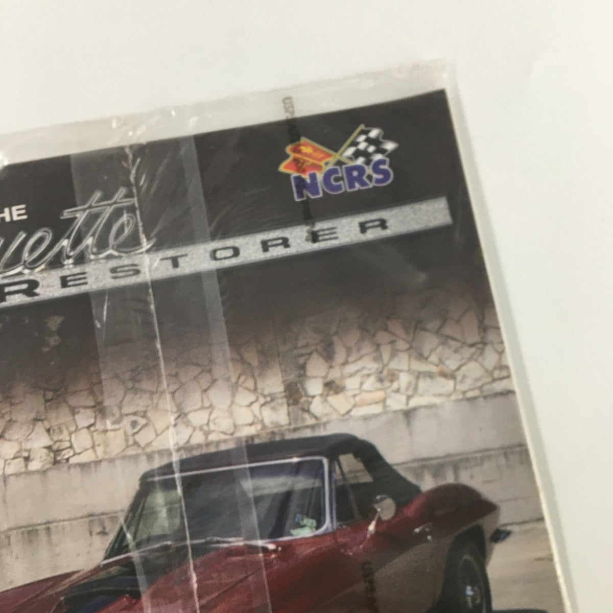 Close-up of The Corvette Restorer Magazine Fall 2006 Volume 33 Issue 2 showcasing the title and emblem, emphasizing its focus on Corvette restoration.