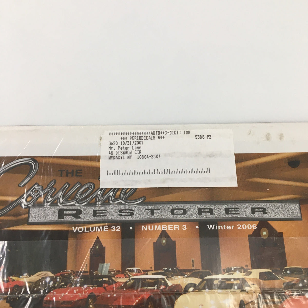 Close-up of The Corvette Restorer Magazine Winter 2006 Vol. 32 #3 showing the cover and subscription label, highlighting its collectible value.