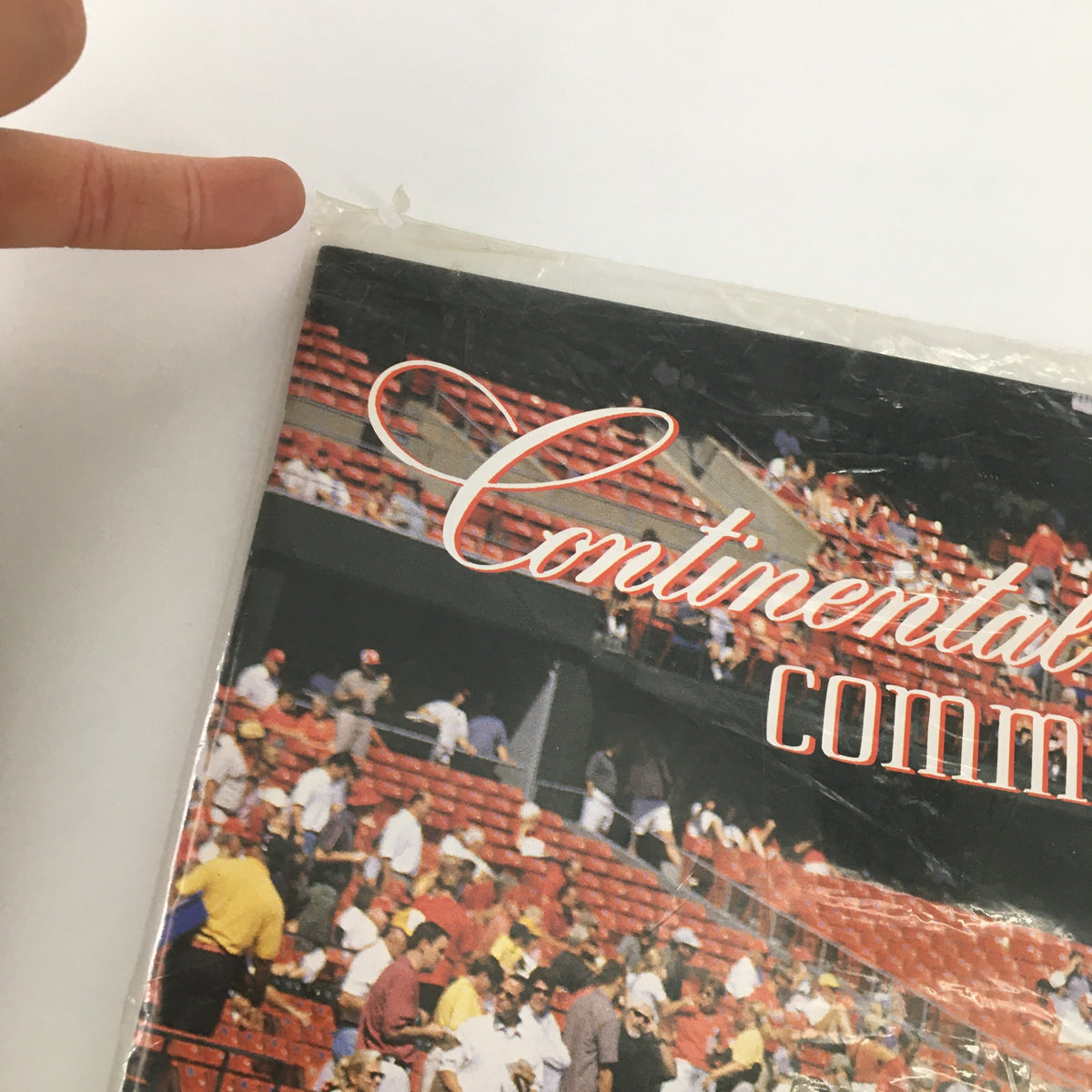 Close-up of Continental Comments Magazine May 2001 #240 showing wear on the plastic wrap and the magazine title.