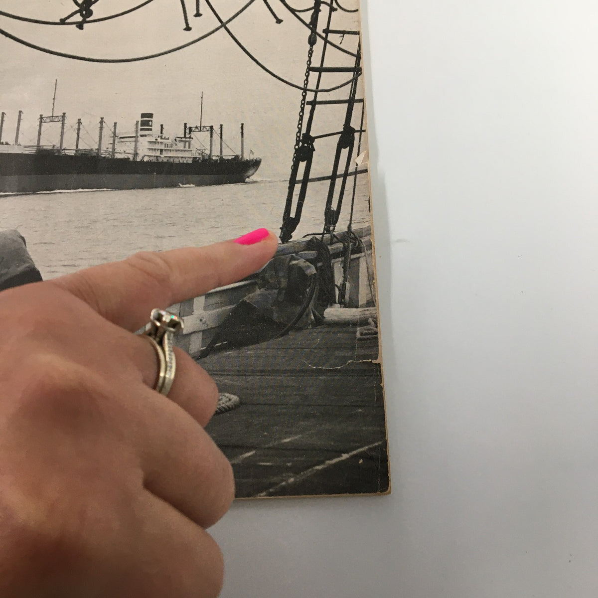 Close-up view of the VTG Ships and the Sea Magazine Summer 1959 cover, highlighting the C2 Freighter and a hand pointing to details on the magazine.