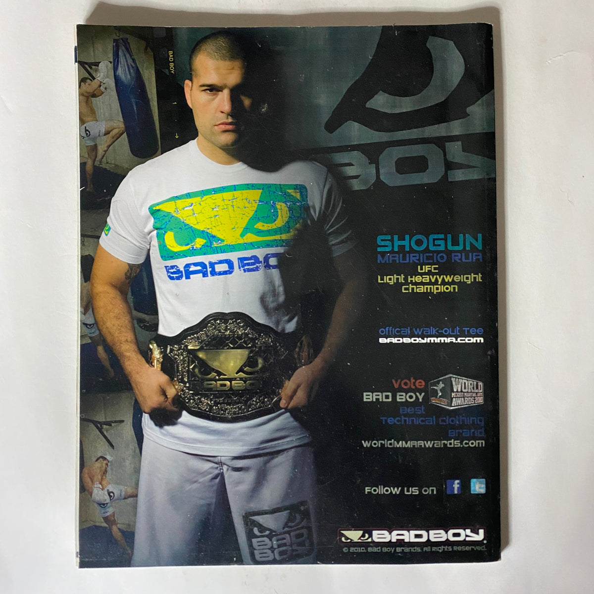 Back cover of the Fighters Only US Magazine December 2010, displaying ad for BAD BOY clothing featuring Shogun Mauricio Rua with his championship belt.