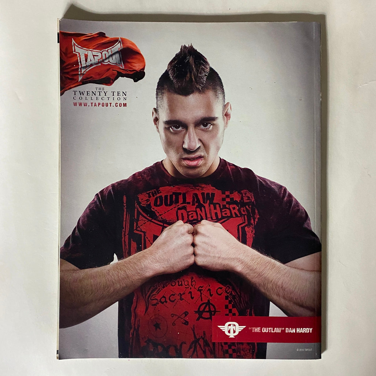 Fighters Only US Magazine June 2010 back cover featuring Dan Hardy in a striking pose, wearing a dark shirt and showcasing a mohawk hairstyle, part of the vintage MMA collection.