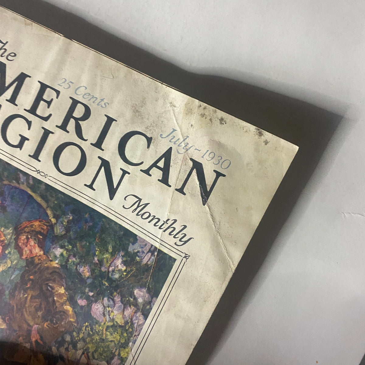 Close-up view of the top section of VTG The American Legion Magazine July 1930 showing details on the title and date along with minor signs of wear.