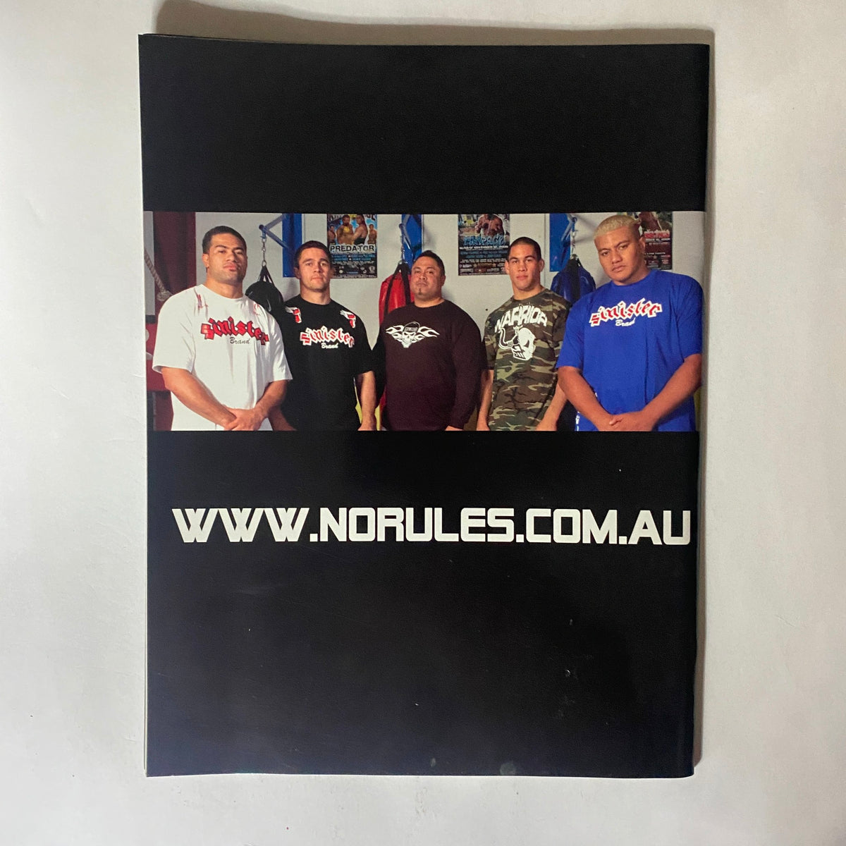 Back cover of MMA Sports Magazine Issue 8, displaying a group photo of MMA fighters with the website www.norules.com.au promoting MMA culture and community.
