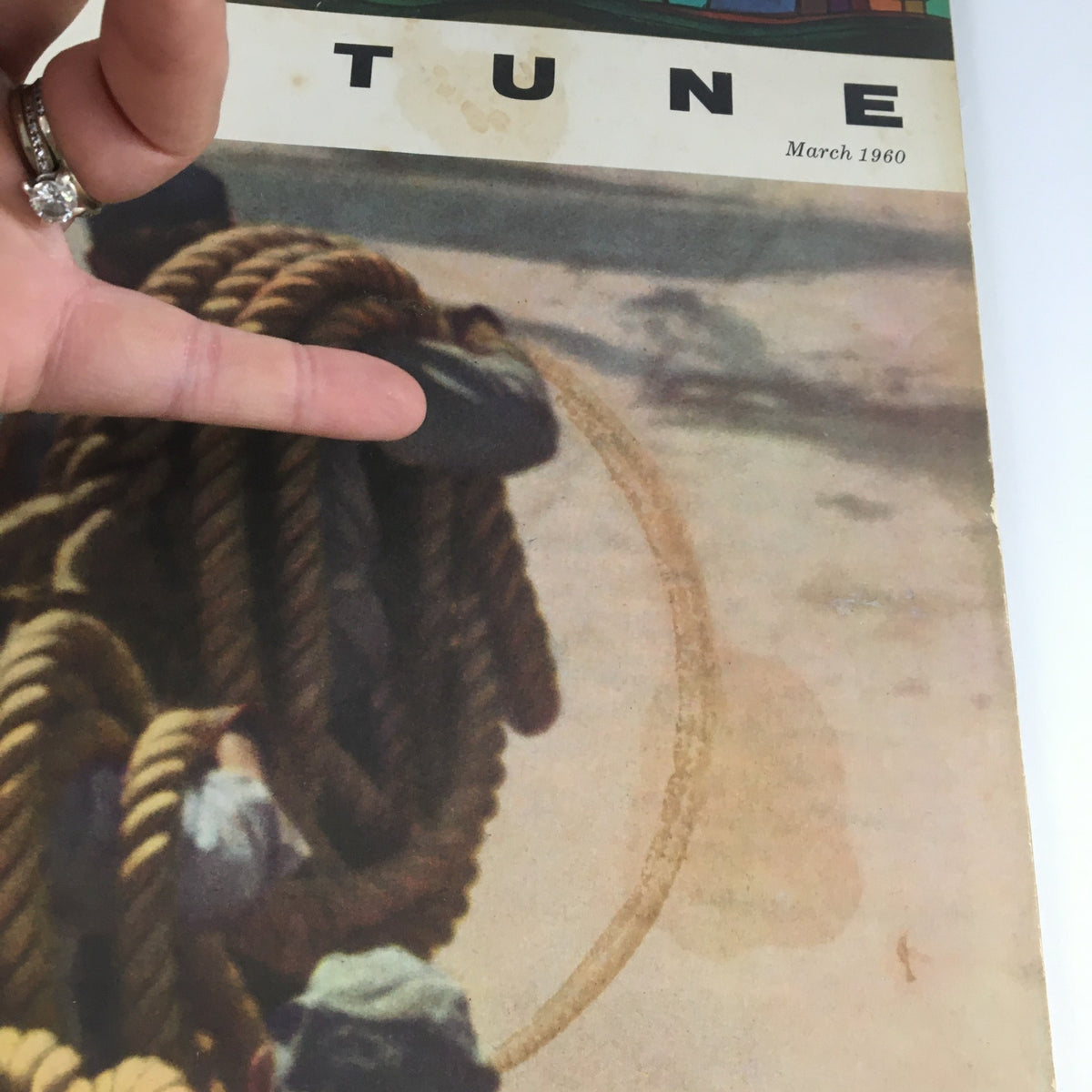 Close-up of the March 1960 issue of Fortune Magazine cover showing hands pointing at the ropes held by figures, capturing the magazine's historical context linked to George T. Baker's Feud.