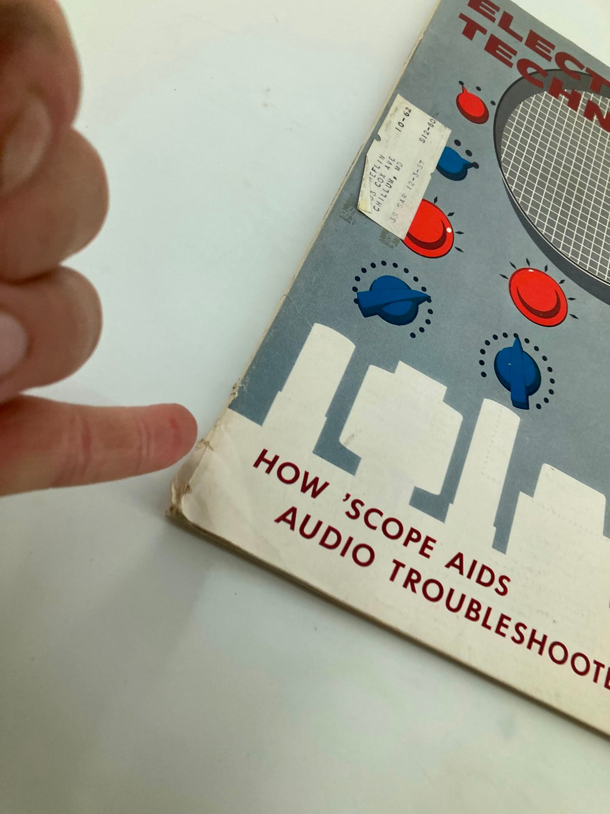 Side view of the VTG Electronic Technician Magazine November 1959, showing age-related wear and a label, emphasizing its vintage character.