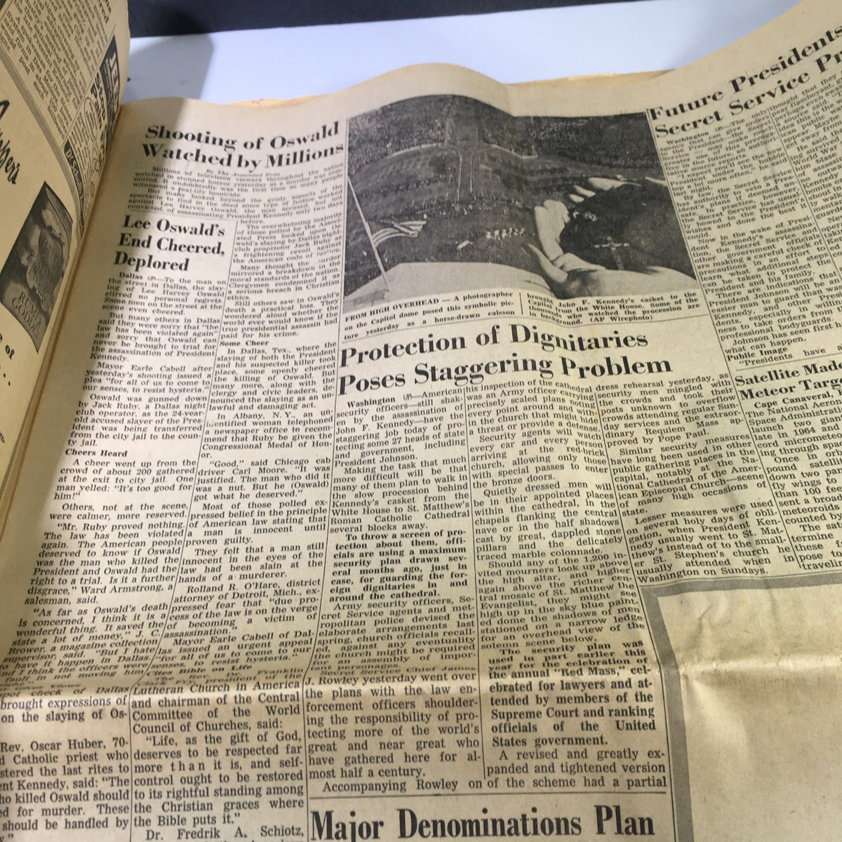 Inside page of VTG The Courier News Newspaper from November 25, 1963, detailing the public reaction to Lee Harvey Oswald's shooting and the challenges concerning the protection of dignitaries.