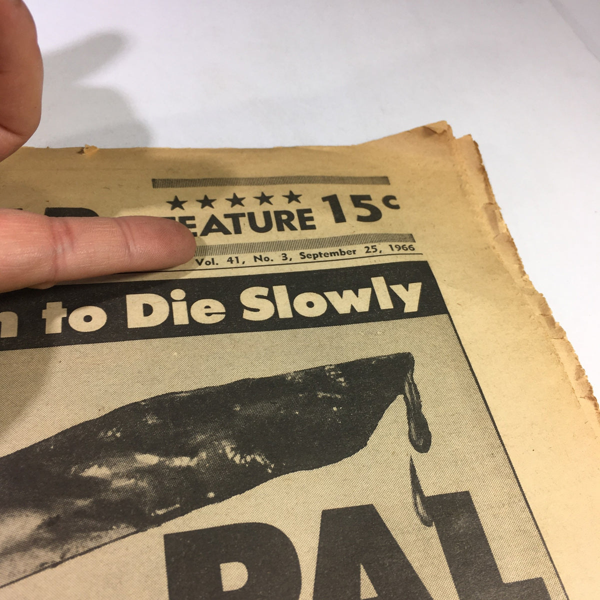 Close-up of the National Enquirer Newspaper from September 25, 1966 displaying details including Volume and date, with headline focusing on a dramatic criminal story.