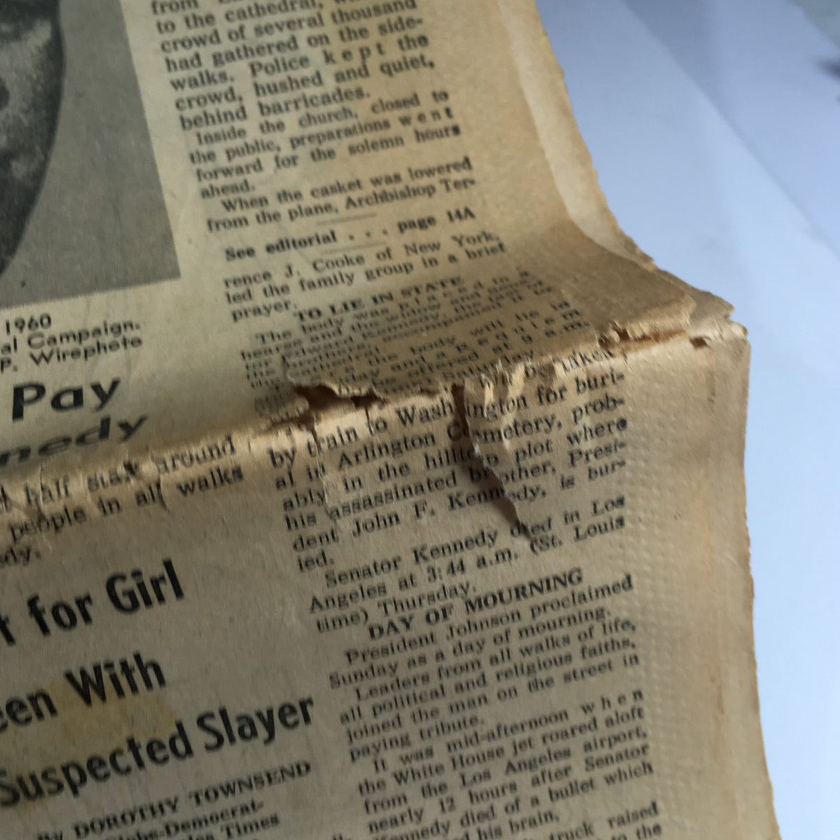 Detail of the VTG St. Louis Globe-Democrat newspaper from June 7, 1968, showcasing the condition of the paper with noticeable wear around the edges. This authentic historical document features stories related to John and Robert Kennedy.