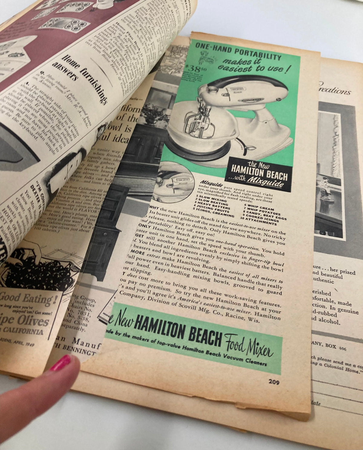 Page inside VTG Better Homes & Gardens Magazine July 1949 focusing on a Hamilton Beach mixer advertisement, showcasing vintage kitchen products popular during the mid-20th century.
