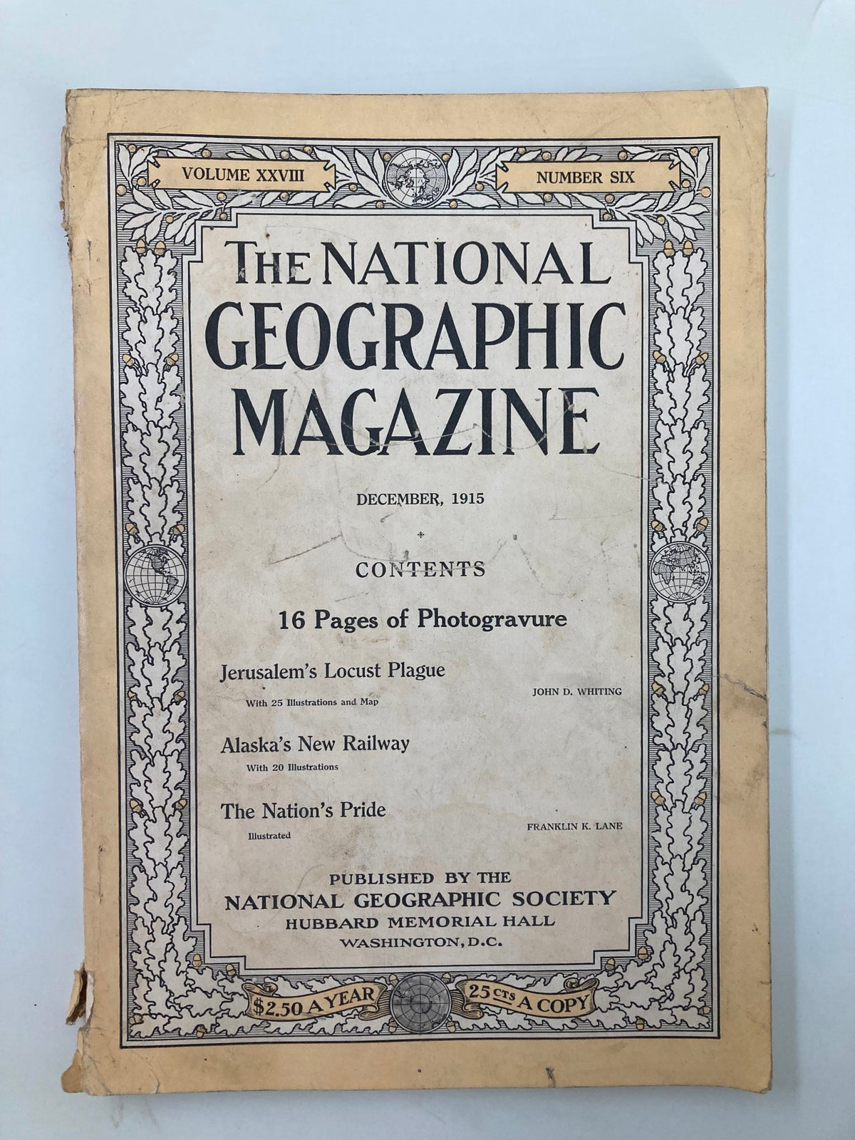 Cover of National Geographic Magazine, December 1915, featuring contents such as 'Alaska's New Railway' and 'Jerusalem's Locust Plague.'