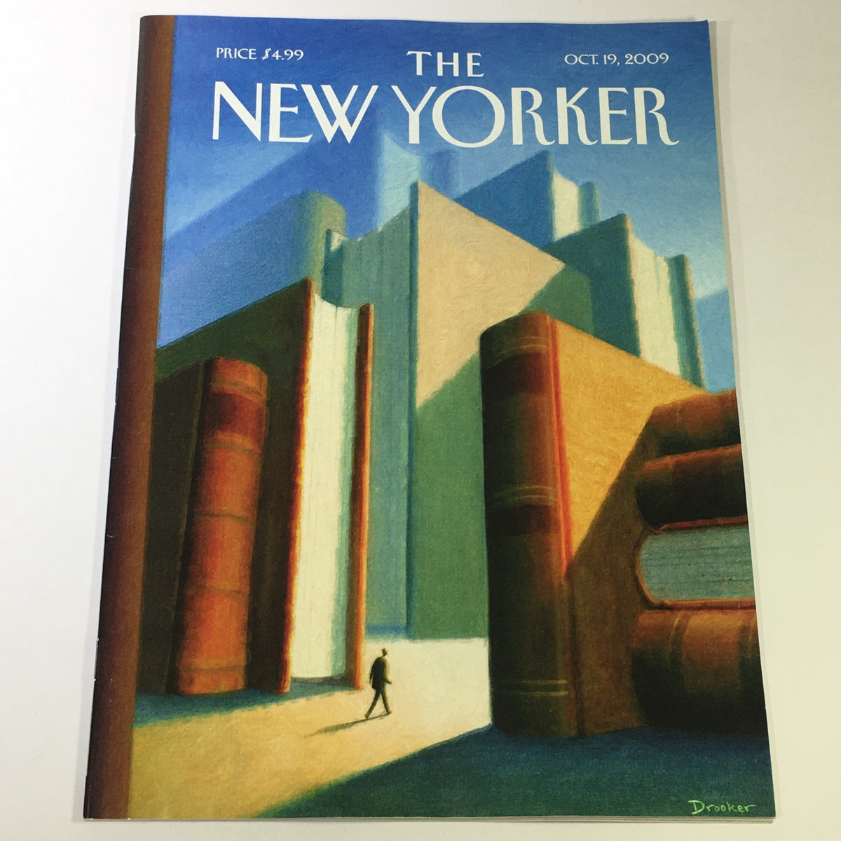 The New Yorker October 19 2009 magazine cover featuring a striking illustration by Eric Drooker, showcasing a silhouette figure walking in front of towering books and architectural elements.