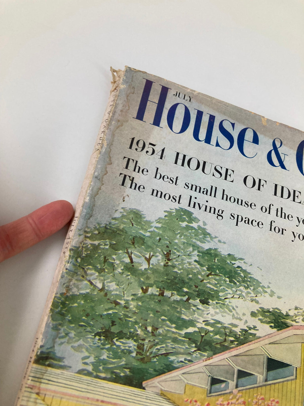 Cover detail of VTG House & Garden Magazine July 1954, showcasing mid-century design and the caption 'The most living space for your money' with a scenic background.