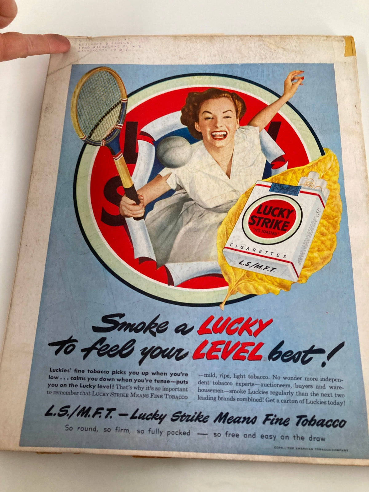 Back cover advertisement in Better Homes & Garden Magazine May 1949 promoting Lucky Strike cigarettes with a cheerful woman, showcasing vintage advertising design.