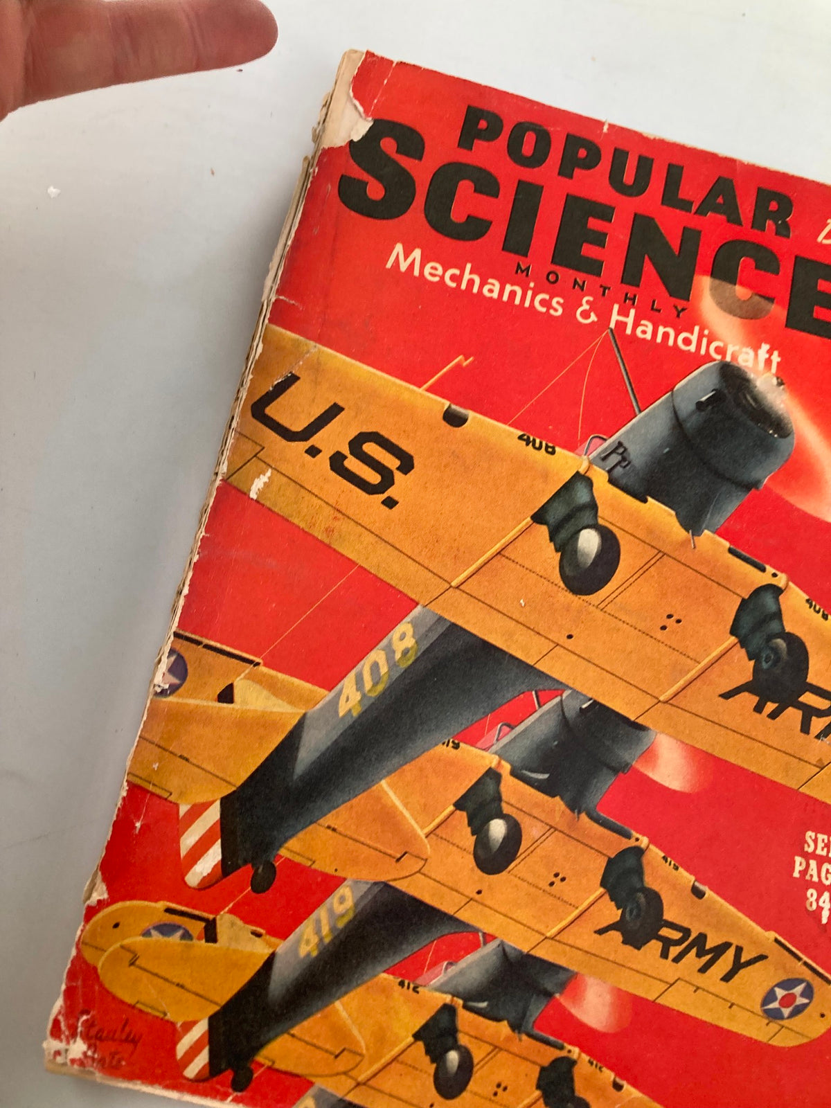 Close-up view of the VTG Popular Science Monthly Magazine Cover from December 1939, featuring yellow airplanes and emphasizing vintage mechanics and craftsmanship.