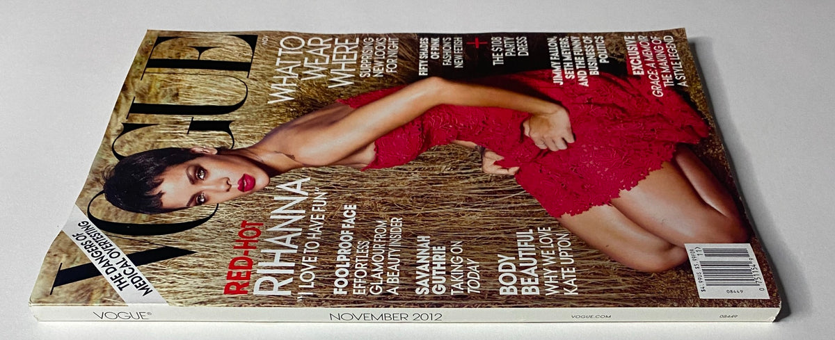 Side view of the Vogue Magazine November 2012 showcasing Rihanna on the cover dressed in a red lace gown, highlighting editorial features and special content.