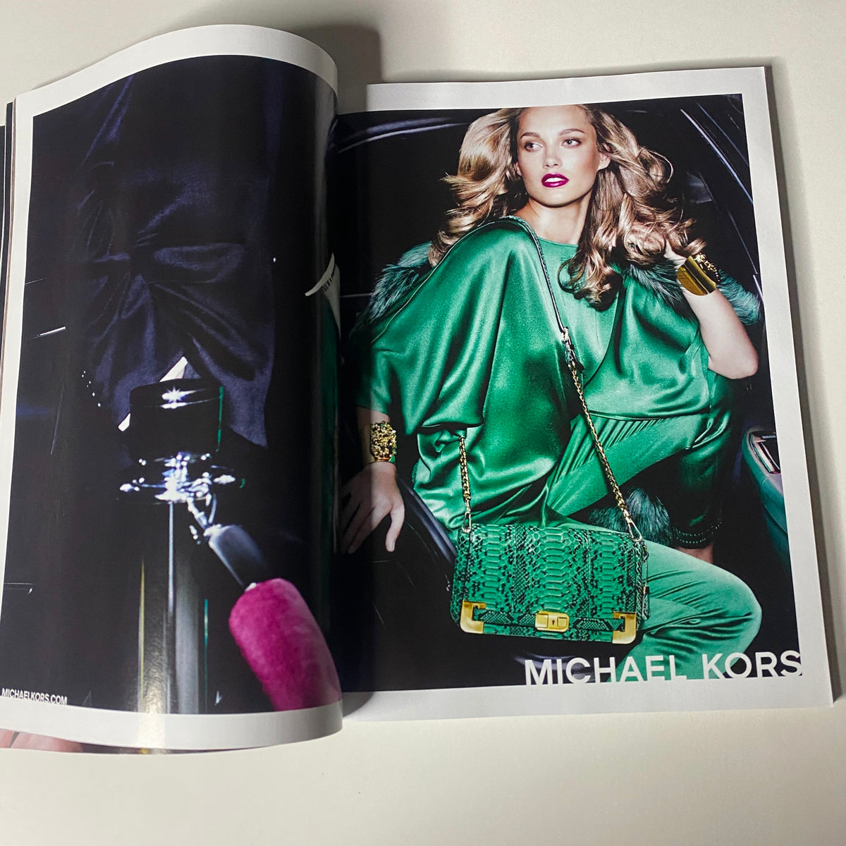 Vogue Magazine November 2012 display of an advertisement for Michael Kors featuring a model dressed in green. The image showcases high fashion and style in the context of the magazine's editorial content.