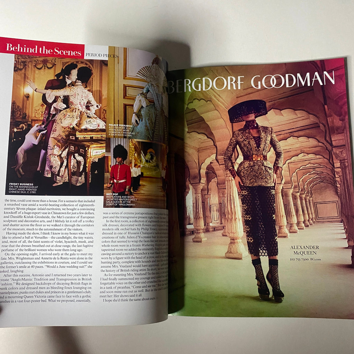 Inside spread of Vogue Magazine 2013 Met Gala, displaying an article on Alexander McQueen with an elegant design layout and captivating fashion imagery.