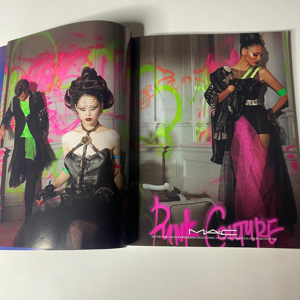 Vogue Magazine 2013 Met Gala - Sarah Jessica Parker Cover No Label VG - A visually striking spread showcasing edgy fashion influenced by punk culture, featuring bold colors and dramatic styling in a high-fashion editorial setting.