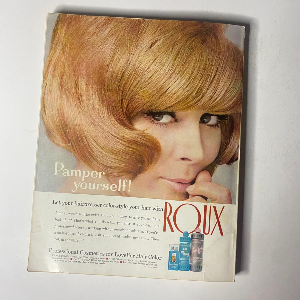 Back cover of Harper's Bazaar Magazine September 1967 featuring an advertisement for Roux hair color, promoting professional hair styling and beauty products.