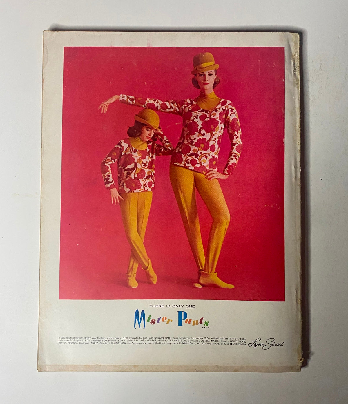Back cover of Harper's Bazaar Magazine August 1963 showcasing a colorful advertisement for Miger Pants, emphasizing 1960s family fashion styles.