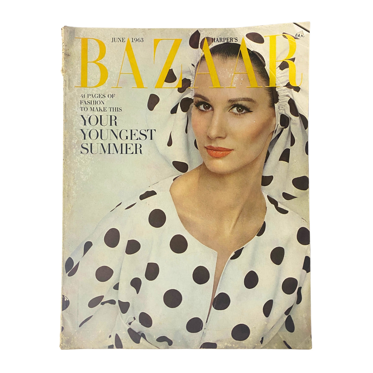 Harper's Bazaar Magazine June 1963 cover featuring 'Your Youngest Summer', showcasing a model with a polka dot outfit and elegant makeup, reflecting the fashion trends of the early 1960s.