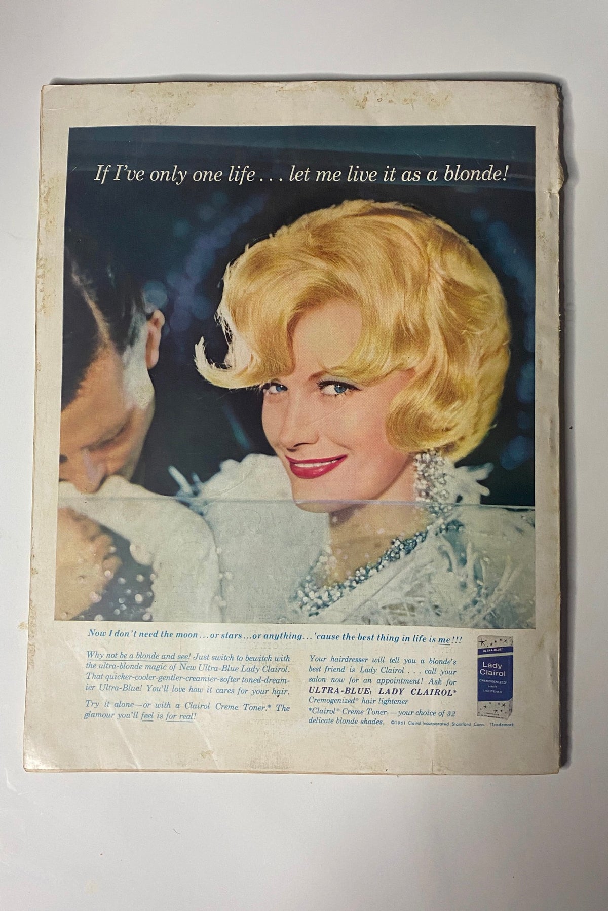 The back cover of Harper's Bazaar Magazine June 1963 'Your Youngest Summer,' featuring a vintage advertisement for Lady Clairol, highlighting beauty and elegance.
