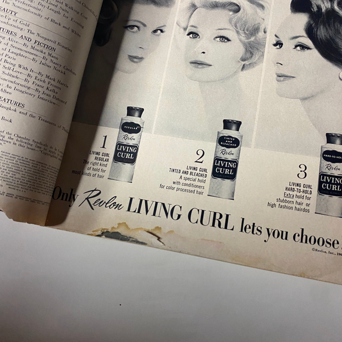 Close-up of a haircare advertisement in Harper's Bazaar Magazine September 1960 showcasing Revlon's Living Curl products with models demonstrating hairstyles.