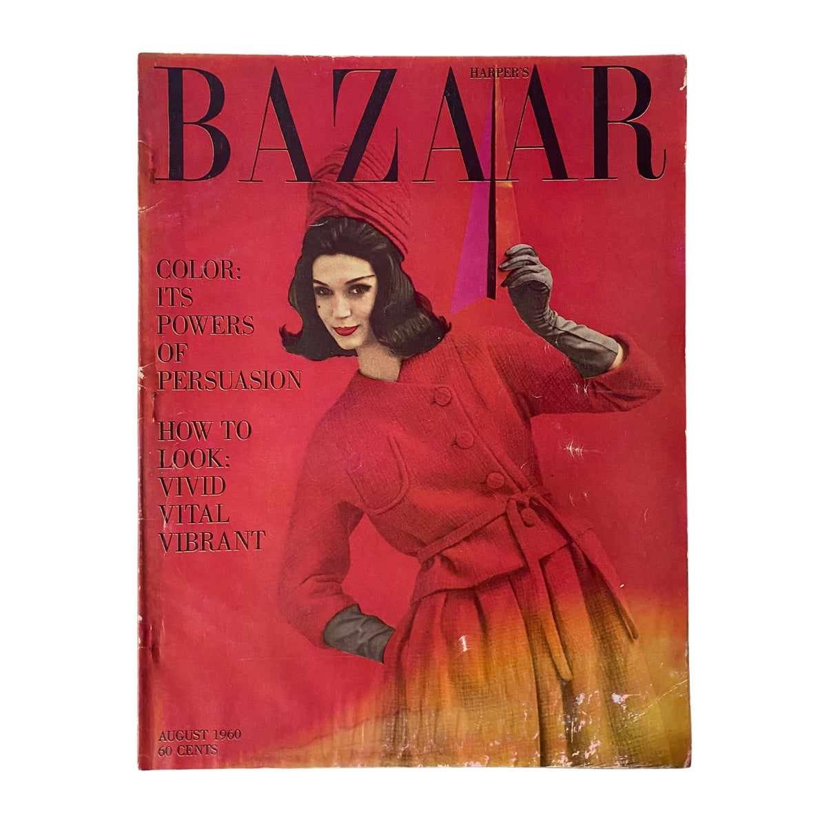 Harper's Bazaar Magazine August 1960 cover featuring a model in a vibrant red coat and hat, with the text 'Color: Its Powers of Persuasion' highlighted, showcasing the magazine's theme of vivid and vital fashion.