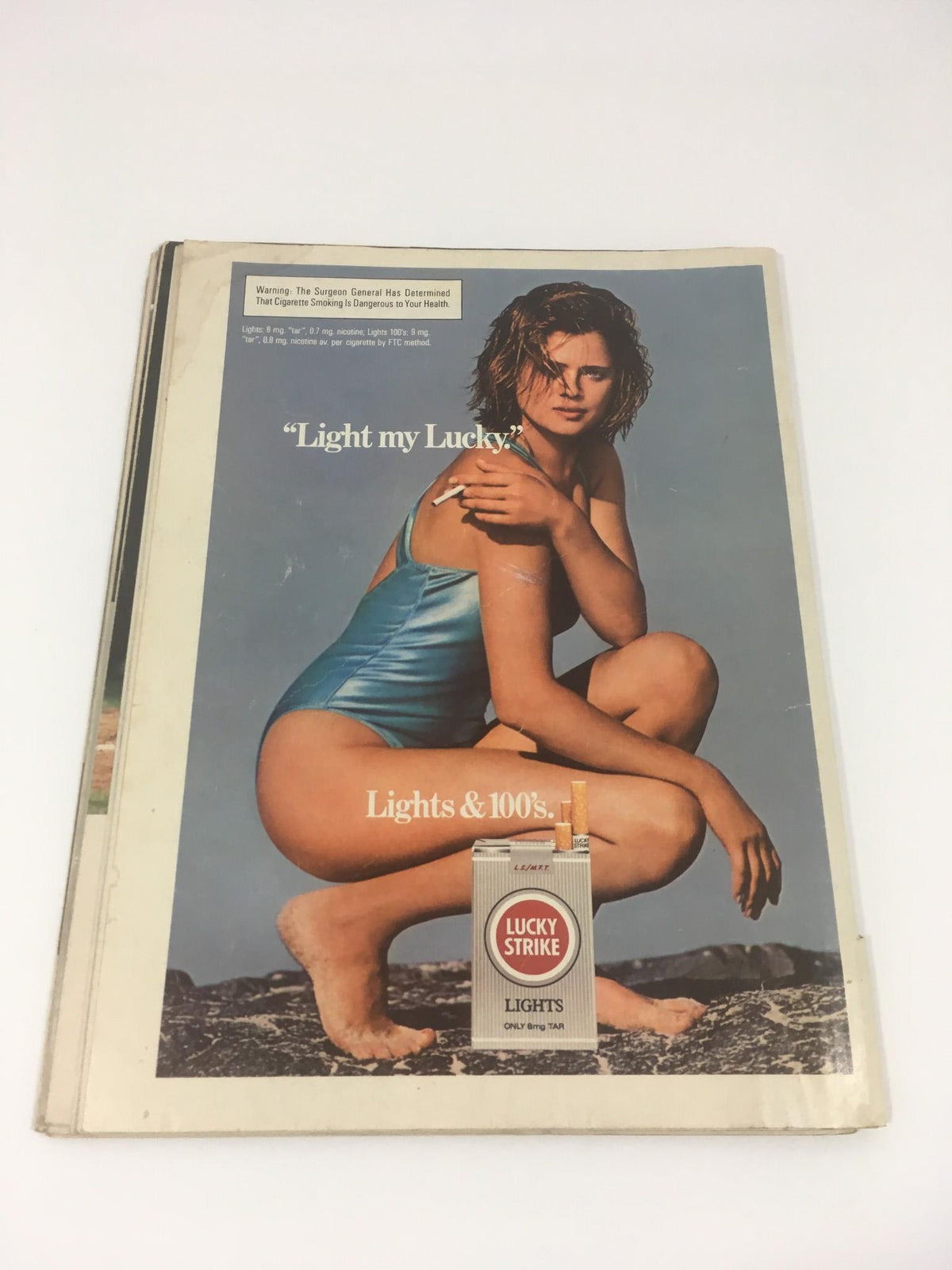 Alternate view of Sports Illustrated March 4, 1985, titled 'The Money Game: Baseball's Millionaires,' showcasing the iconic Lucky Strike cigarette advertisement.