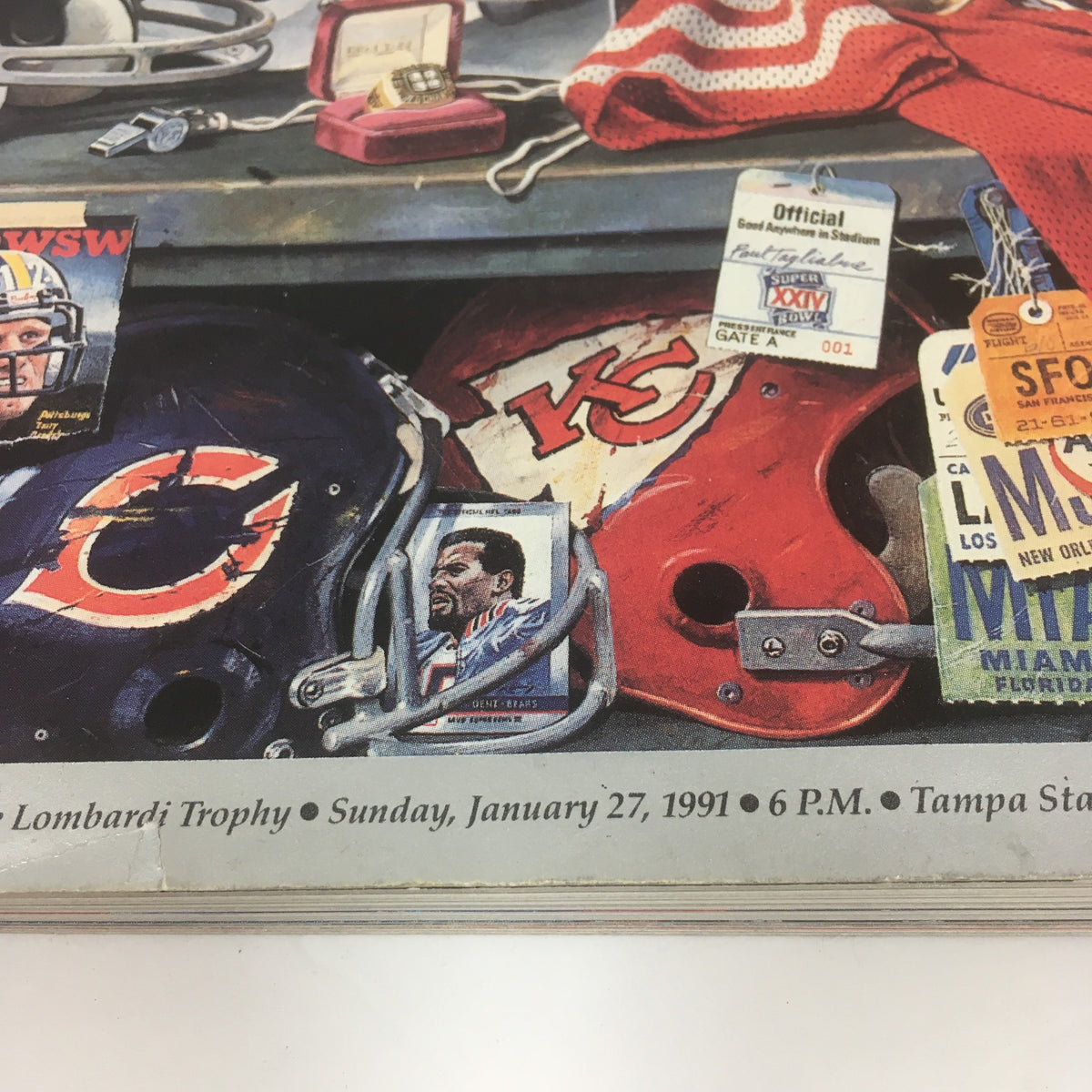 Inside view of the Official Super Bowl XXV Game Program January 27, 1991, displaying helmets, tickets, and memorabilia from the event.