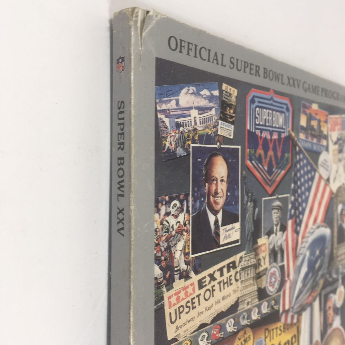 Spine view of the Official Super Bowl XXV Game Program, displaying the title and collage of historic Super Bowl moments.