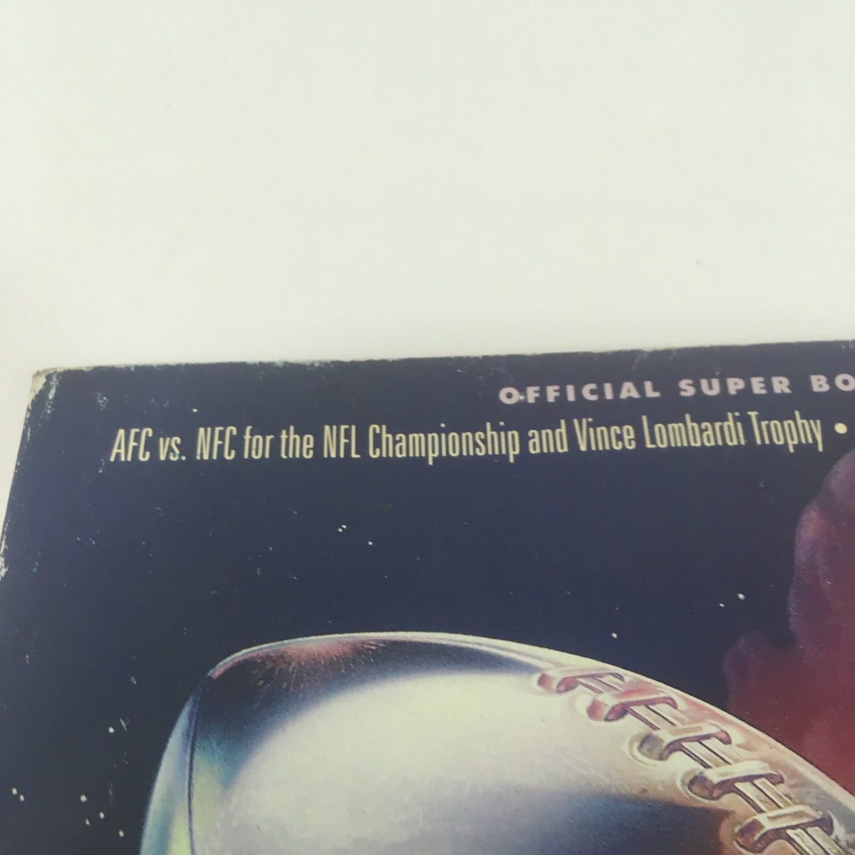 Top section of the Super Bowl XXVI Game Program, dated January 26, 1992, detailing the AFC vs. NFC championship match and the Vince Lombardi Trophy.