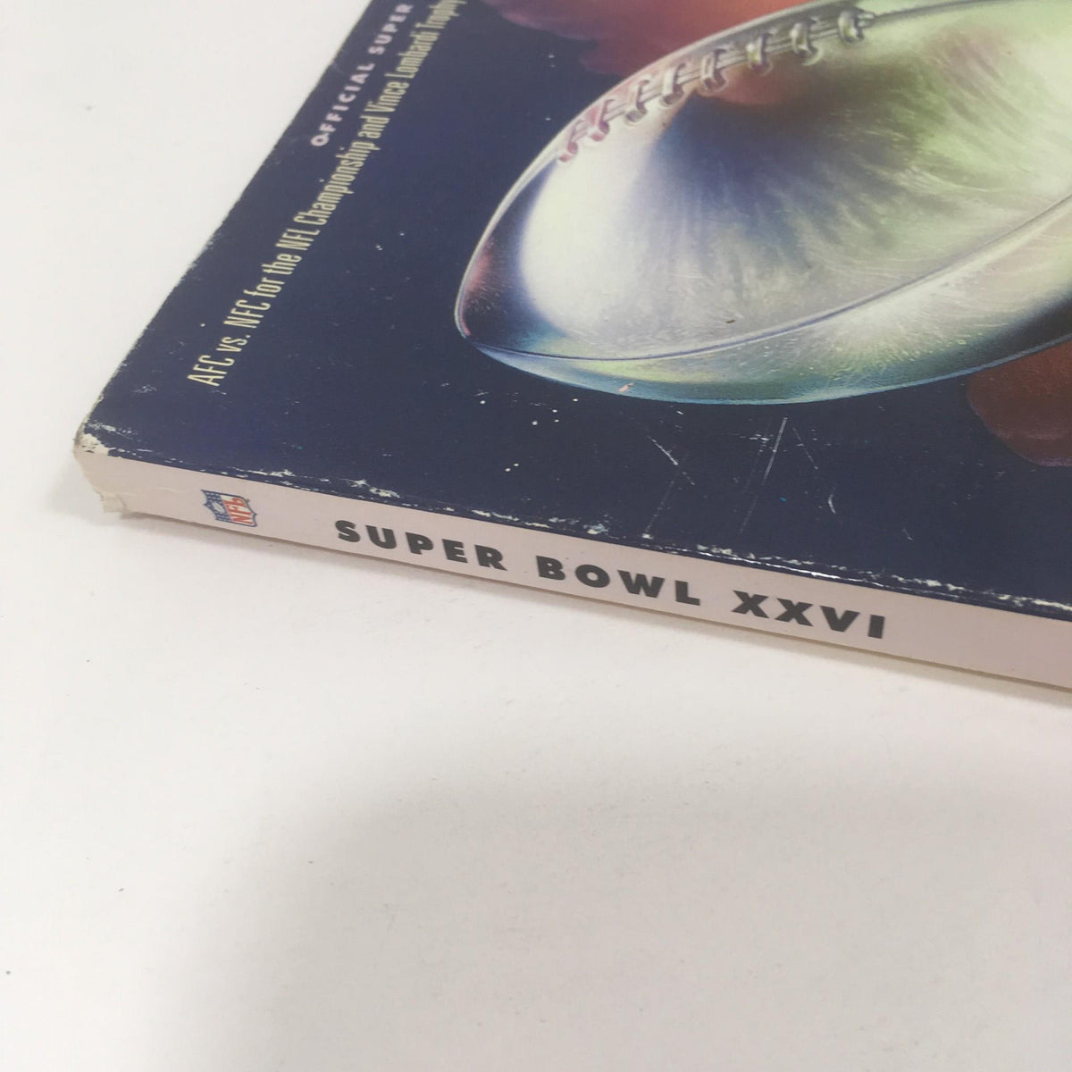 Side perspective of the Super Bowl XXVI Game Program from January 26, 1992, highlighting the title and cover design.