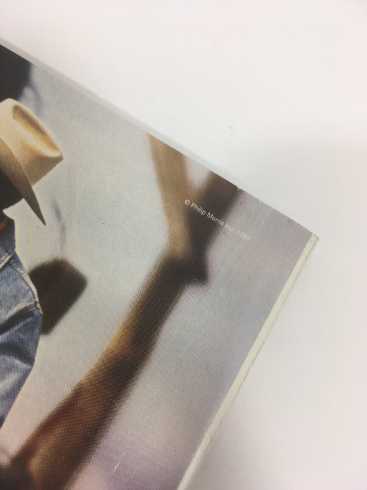 Close-up view of the edge of the 1997 World Series Major League Basketball Official Program, highlighting the publication year and logo, representing a collector's item from the Fall Classic.