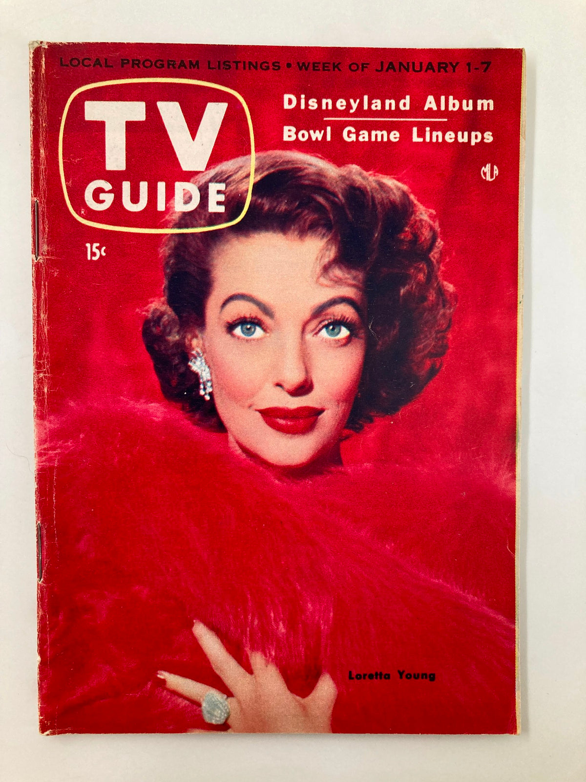 Cover of TV Guide Magazine January 1 1955 featuring actress Loretta Young in a glamorous red outfit, highlighting vintage television culture and programming.