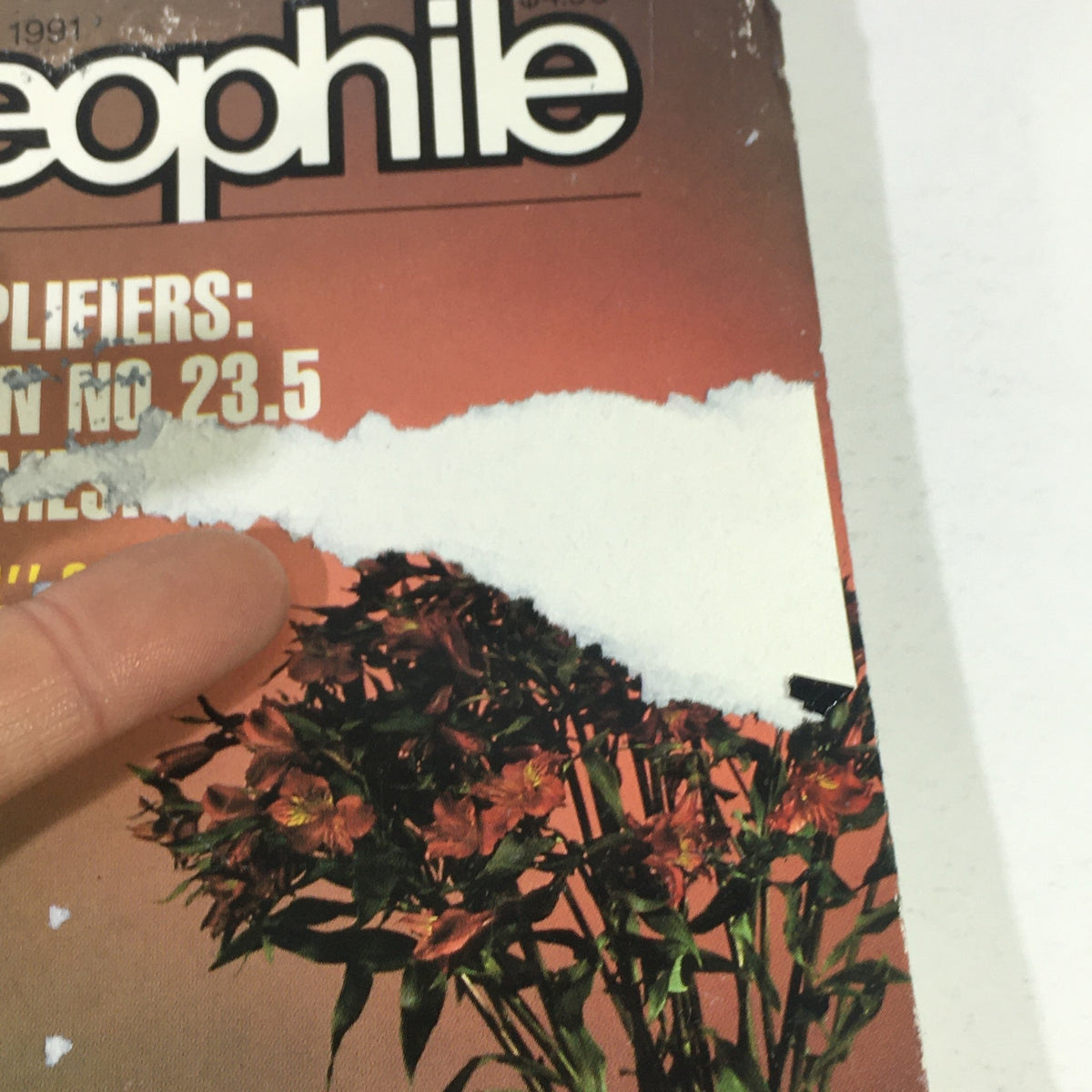 Close-up of the cover of Stereophile Magazine September 1991 with a focus on the title and highlighted features, including the Mark Levinson No. 23.5 AMP.