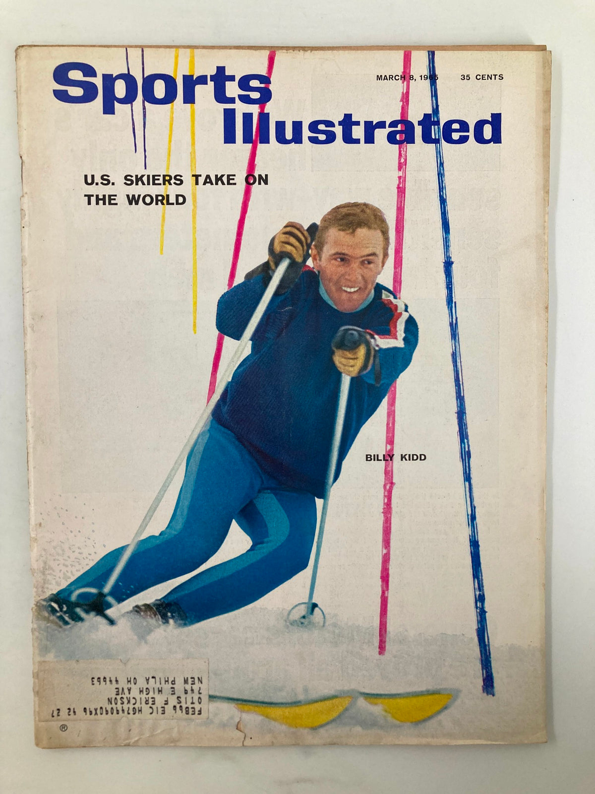 Cover of Sports Illustrated magazine from March 8, 1965, featuring Billy Kidd, a U.S. skier, showcasing skiing action and the headline 'U.S. Skiers Take On The World'. This vintage magazine is a collectible item, highlighting a pivotal moment in sports history.