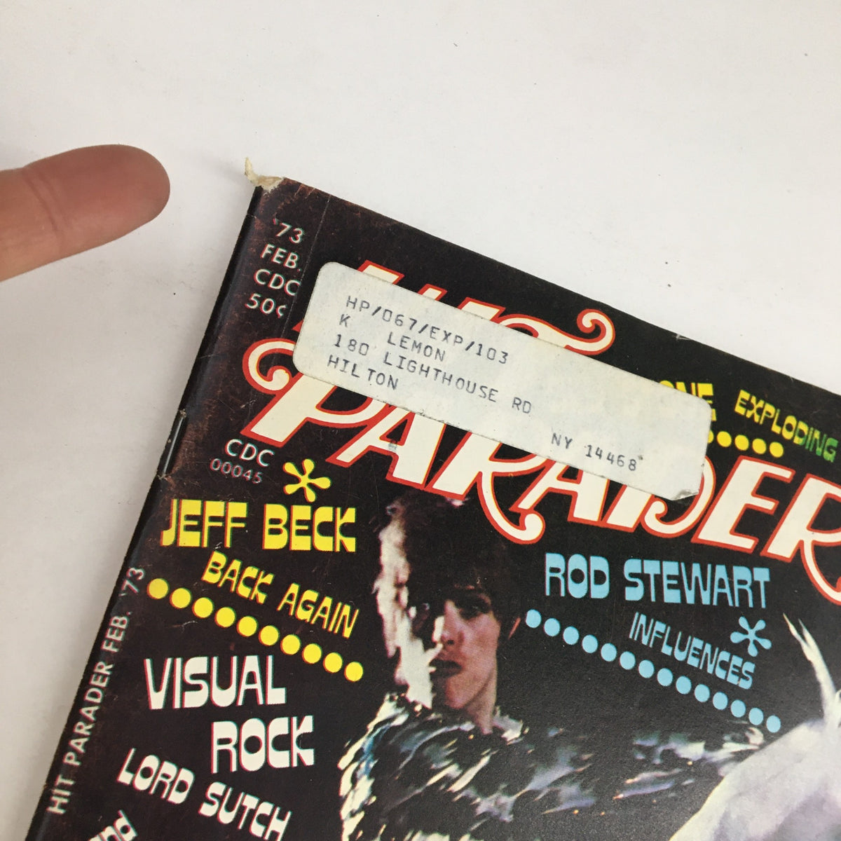 Close-up of the top corner of Hit Parader Magazine February 1973 showing Jeff Beck and Rod Stewart with a shipping label.