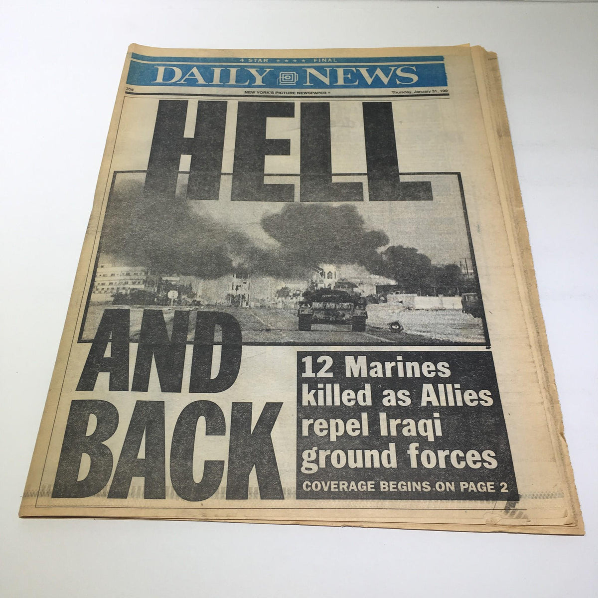 Front page of the NY Daily News from January 30, 1991, featuring the headline 'HELL AND BACK' about the tragic loss of 12 Marines killed as Allies repel Iraqi ground forces. The image captures a significant moment in military history with dramatic imagery reflecting the events of the Gulf War.