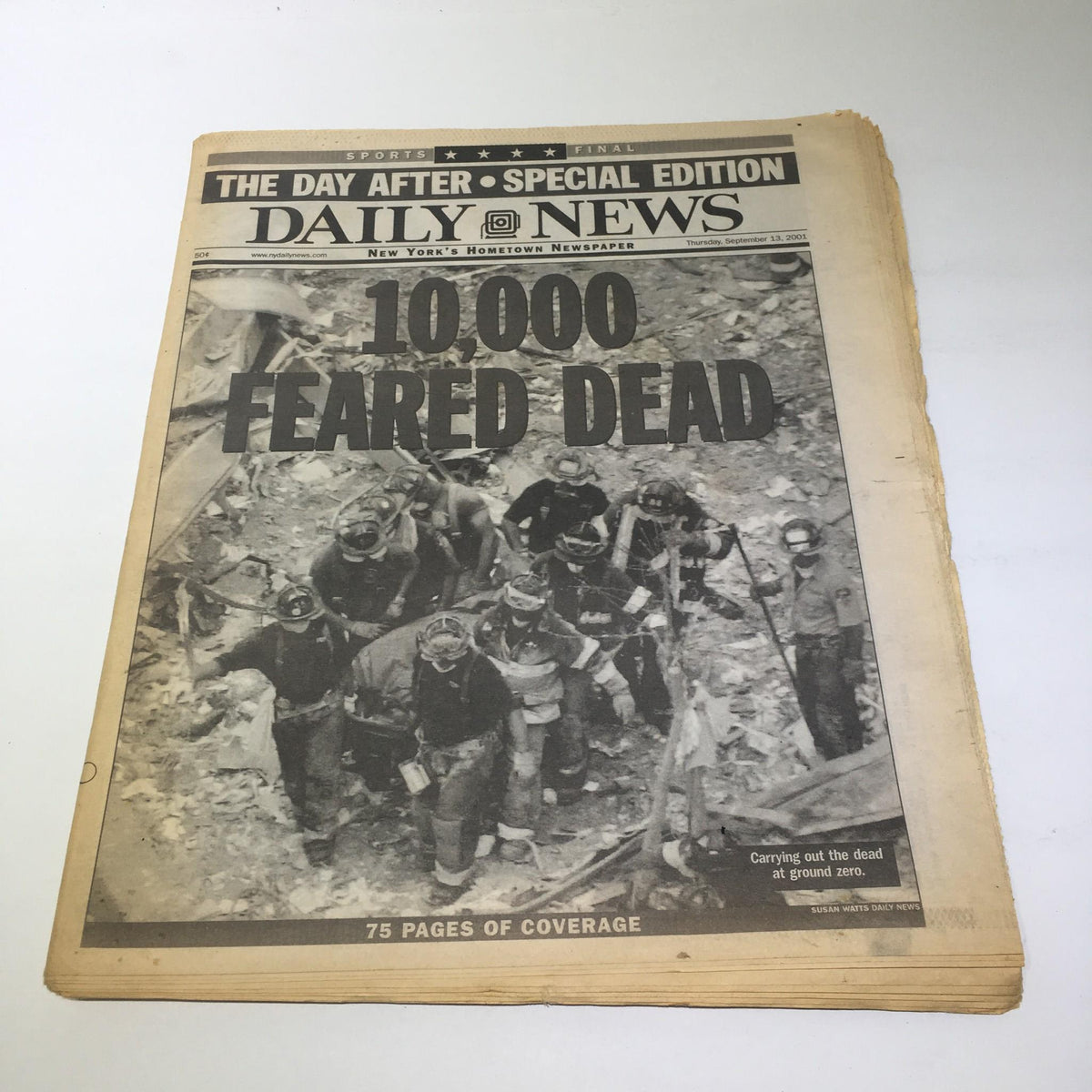 NY Daily News cover, September 13, 2001, featuring headline '10,000 Feared Dead' with images of rescue workers at Ground Zero.