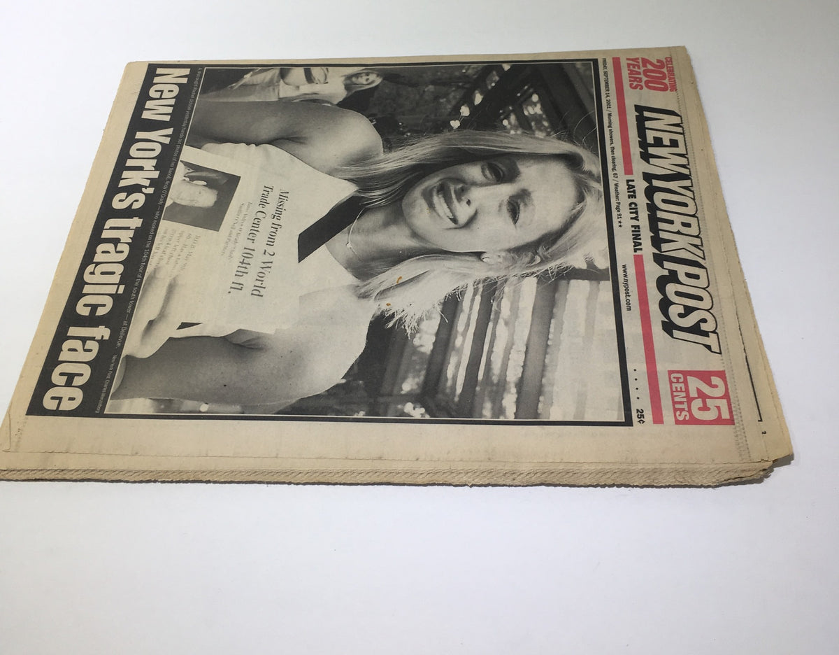 New York Post: Sept 14 2001, New York's Tragic Face - A close-up view of the newspaper showcasing the headline, featuring a poignant image that reflects the emotional impact of the events in New York.