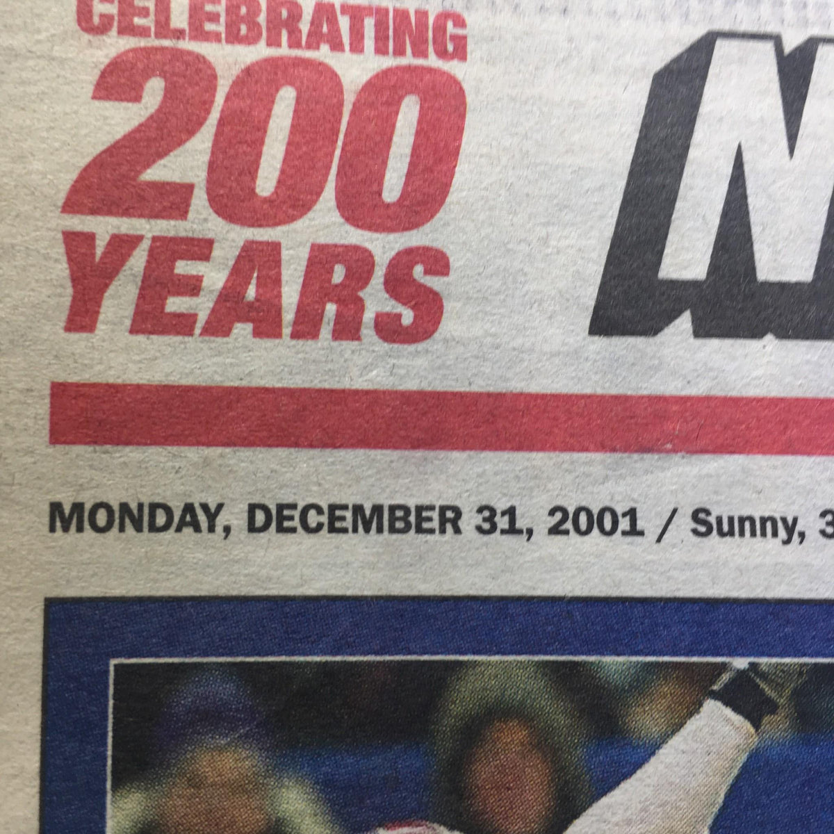 Section of New York Post dated 12/31/2001, highlighting the date and weather while celebrating 200 years of the publication. Includes context about the sports feature on playoff situations.