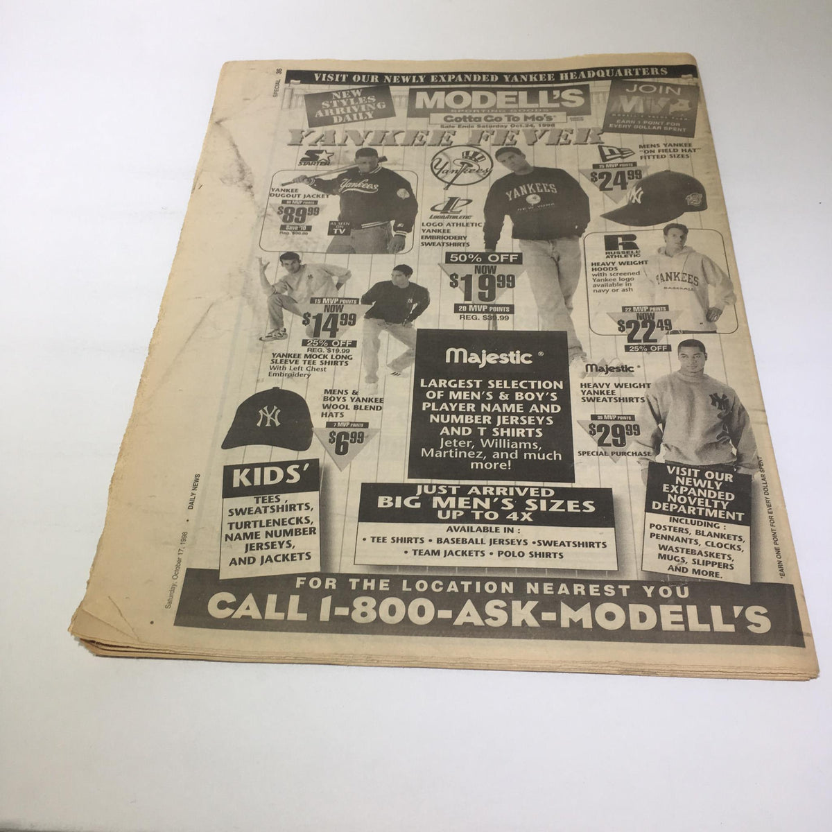 Advertisement from New York Daily News promoting Yankees merchandise and apparel on the back of the sports section.