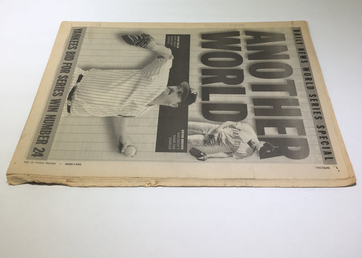 Side view of the New York Daily News front page, prominently displaying the headline 'Another World' with visuals of the Yankees and their quest for the World Series.