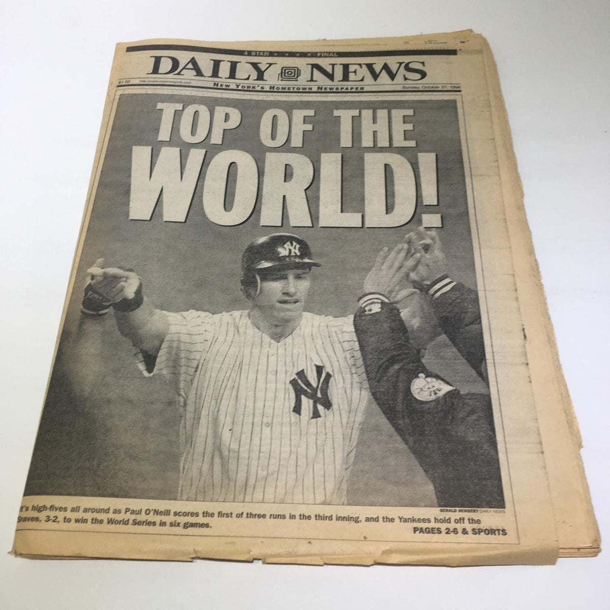 New York Daily News headline 'Top Of The World!' featuring a Yankees player celebrating after scoring during the World Series on October 27, 1996.
