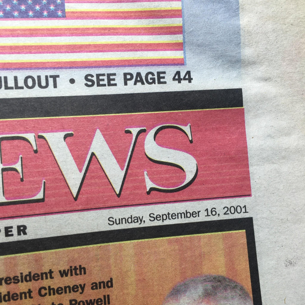 Close-up of the New York Daily News logo and date, Sunday, September 16, 2001, related to the headline 'WE'RE AT WAR'.